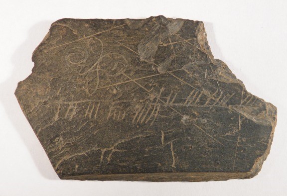 Slate with ogham inscription from Inchmarnock, circa 4th-8th century a.d.