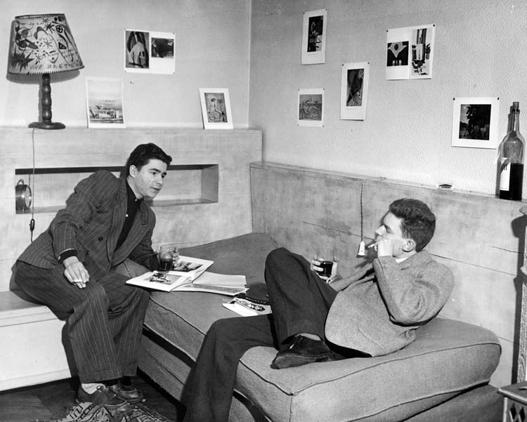 image from Greg Barnhisel's "Perspectives USA and the Cultural Cold War: Modernism in Service of the State": "This Ford Foundation publicity shot depicts two French existentialists straight from central casting—smoking, drinking, slouching, and discussing the latest issue of Perspectives USA. Tacked to the wall are the reproductions of Arthur Dove's paintings from issue 2."