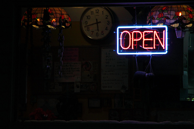 “The OPEN sign flickers. Replace OPEN with acquiescence. Replace OPEN with displace. Replace OPEN with a fist in the mouth. Replace the fist with a lake. The lake chokes on its pronoun.” Photo by MIKI Yoshihito, via <a href= https://flic.kr/p/9cuuuY>Flickr</a>.
