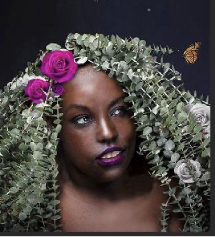 Vanessa Rochelle Lewis with flowers and eucalyptus strands in her hair