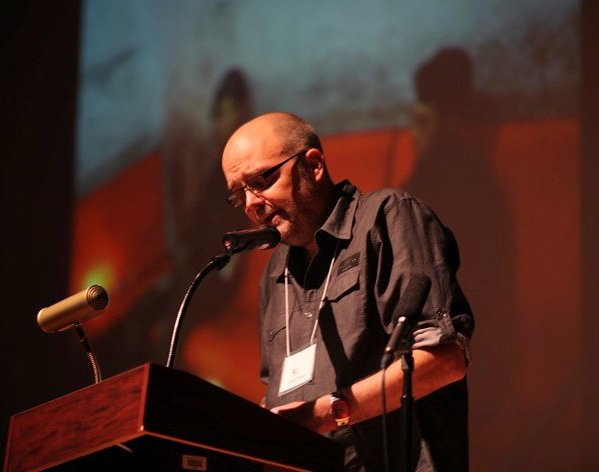 Mark Nowak reads at the Split This Rock Poetry Festival in 2010 (photo by Jill Brazel)