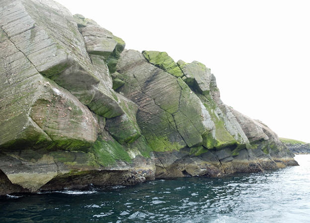 Coastline at Score Head, Shetland Islands. Photo by John Allan via <a href= https://commons.wikimedia.org/wiki/File:Coastline_at_Score_Head_-_geograph.org.uk_- _3586694.jpg>Wikimedia Commons</a>.