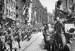 Baldur von Schirach, Gauleiter of Vienna, at right, saluting Baldur von Schirach, Gauleiter of Vienna, at right, saluting