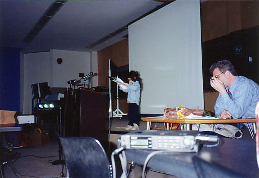 Liaizon Wakest at New Coast Festival, SUNY-Buffalo, 1993; Mike Basinski and DAT recorder at right. Photo by Chris Funkhouser Liaizon Wakest, Mike Basinski, DAT recorder, New Coast festival, Buffalo 1993